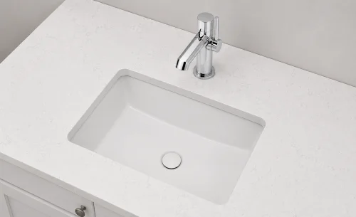 Quartz-topped bathroom vanity with undermount sink and chrome faucet